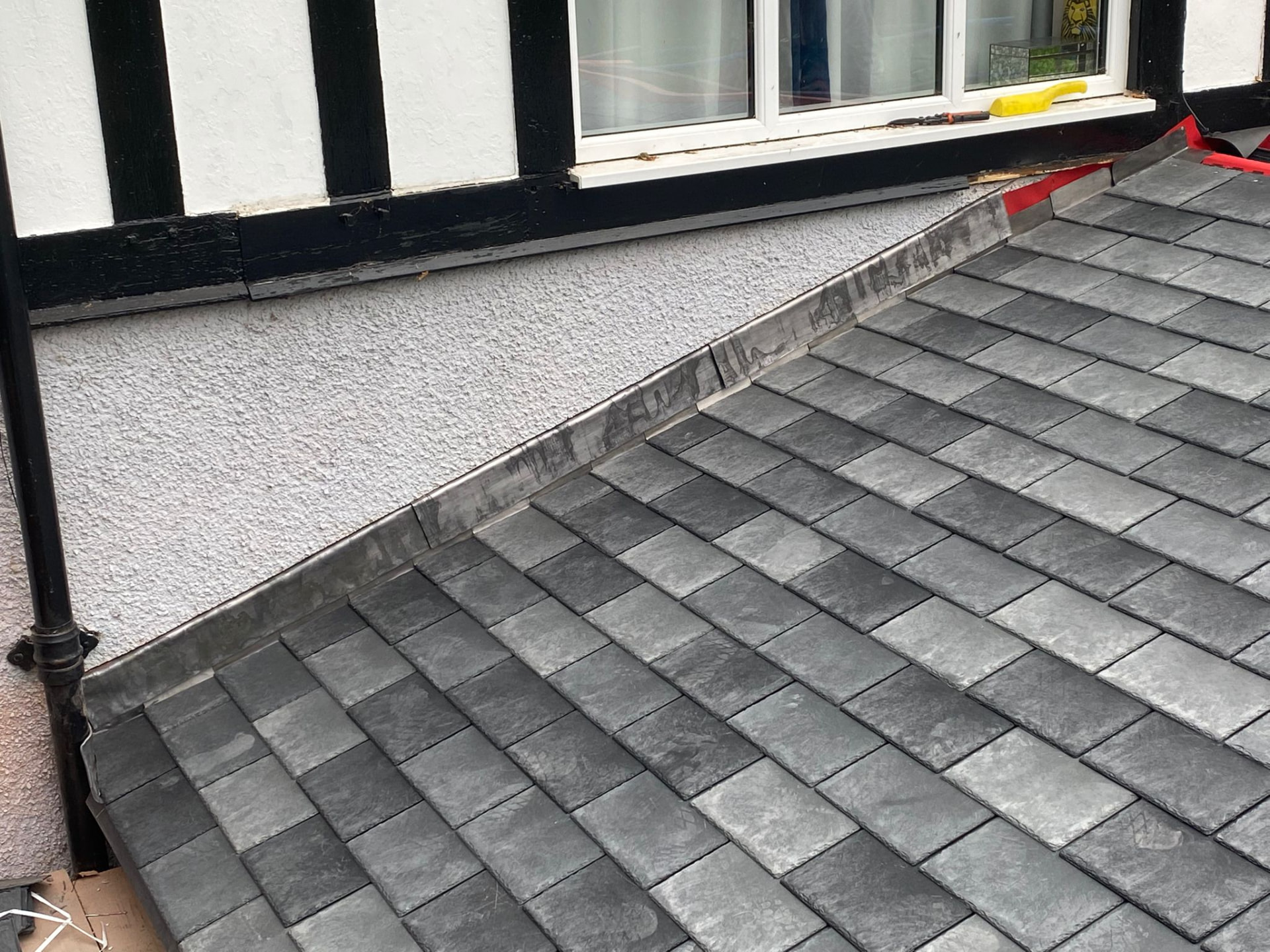 Finished lead flashing and lead valley work on a slate roof