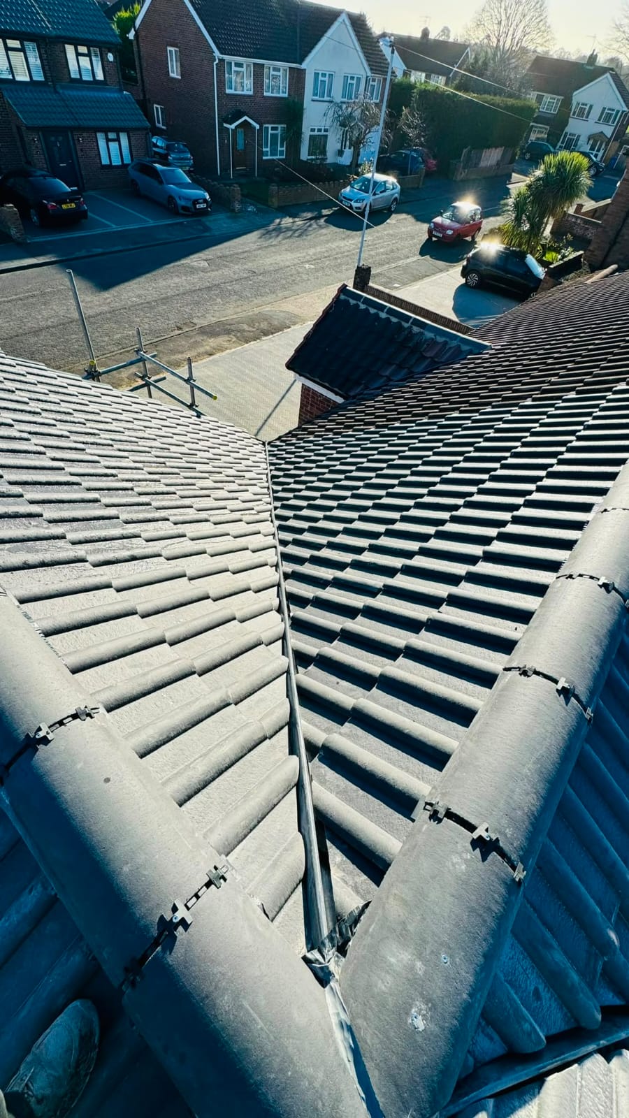 Completed tiled roof with new ridge tiles and guttering in North Wales