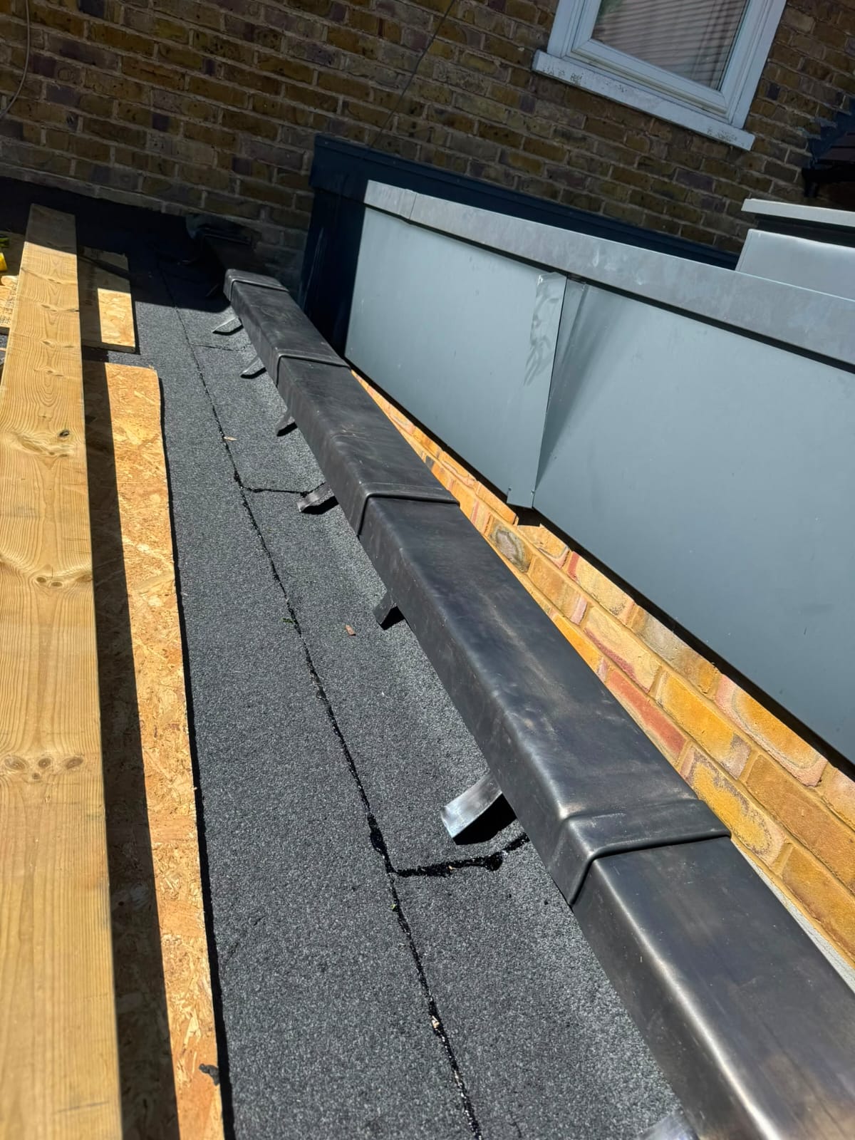 Finished lead flashing and lead valley work on a slate roof